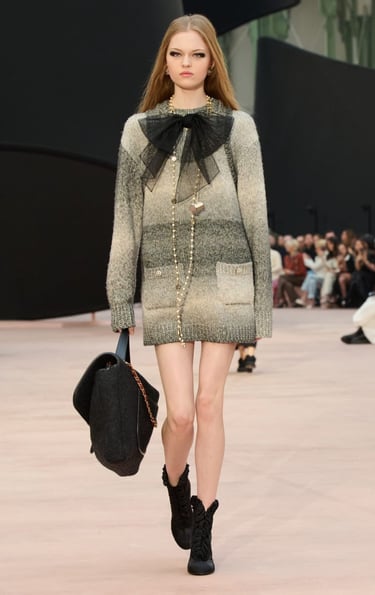 Ombre knit sweater dress with sheer black bow at Chanel FW25/26.