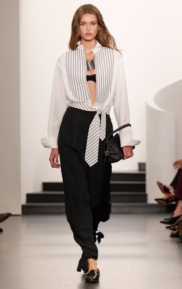 Ralph Lauren Spring/Summer 2026 monochrome striped blouse with black trousers on the runway.