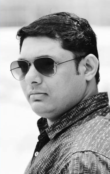 a man with sunglasses is the Founder and CEO of Garuda Digital Arts Photography