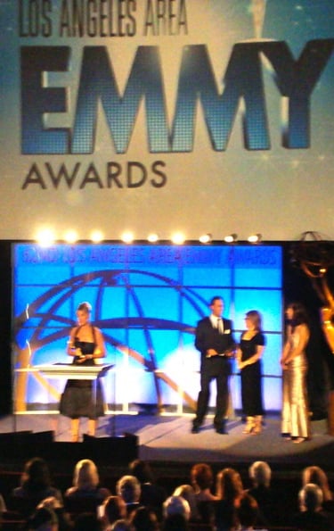 Angie Crouch accepts Emmy Award on stage in Los Angeles
