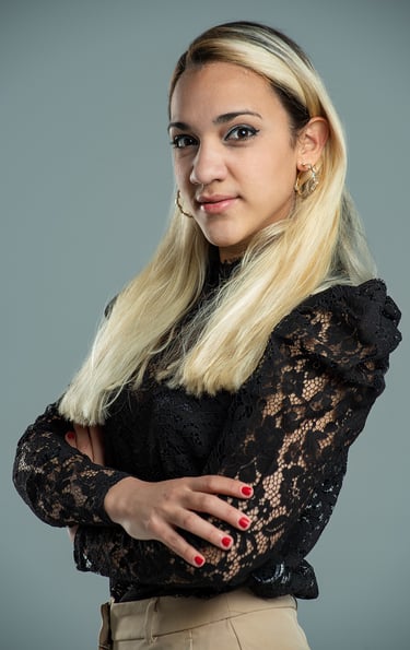 a woman with blonde hair and a black top