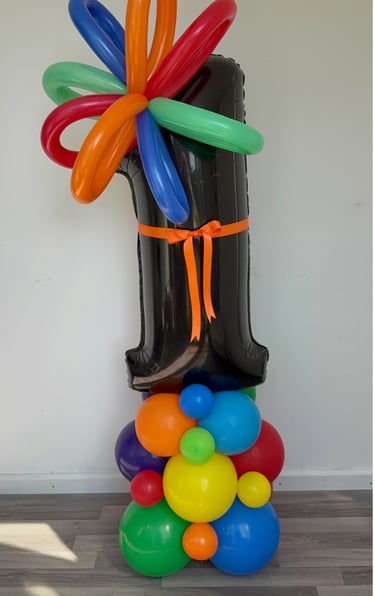 a birthday foil balloon - shaped balloons with a large foil number