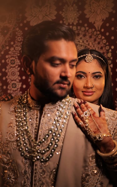 Romantic pre-wedding portrait of a smiling Indian bride with eyes closed, highlighting her glowing b