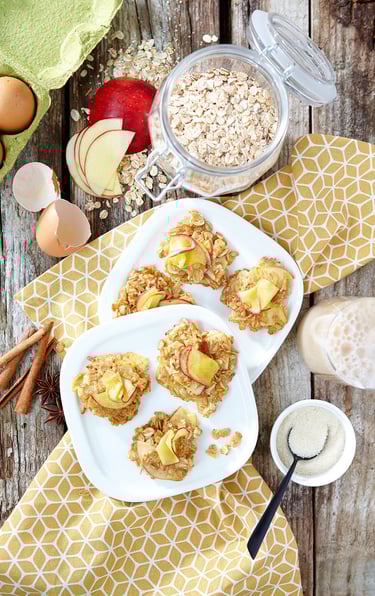 a plate of food with apples and oatmeal on it