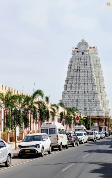 White Gopuram of Sri Ranganathaswamy Temple with massive outer walls resembling a fortress in Srirangam, Tamil Nadu.