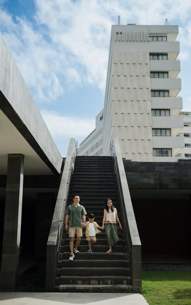 Family walking together at The Meru Sanur Bali during a relaxed family photography session