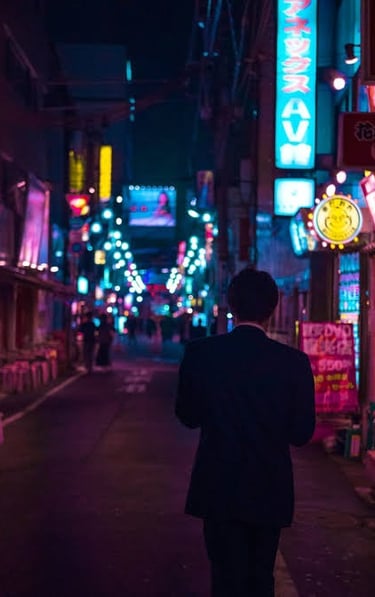 a man in a suit walking down a neon light street