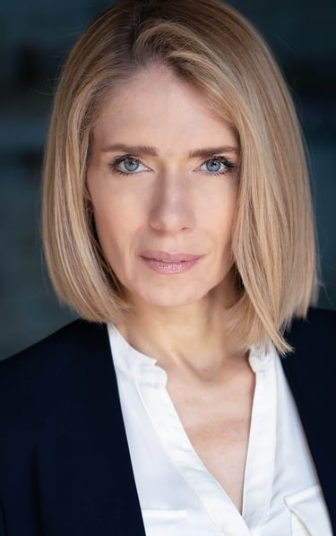 a woman with blonde hair and a white shirt