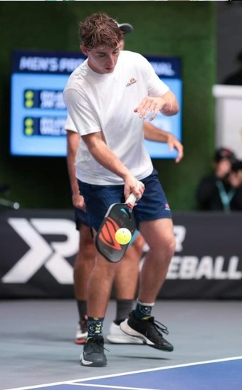 Dylan Frazier with the serve