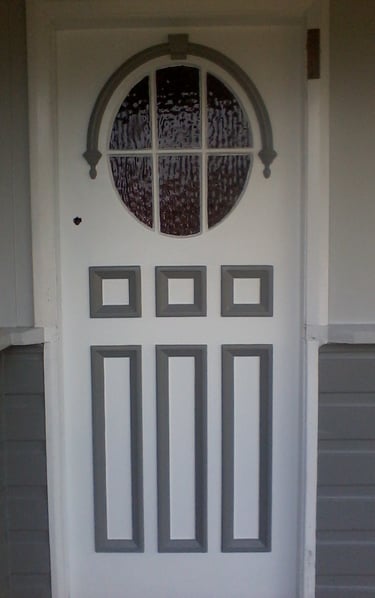 Freshly painted residential front door with grey trim detail