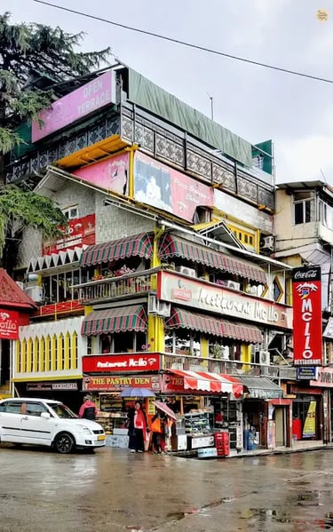 McLeod Ganj square with cafés and local shops.
