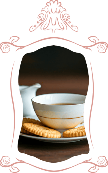 Tea cup with biscuits surrounded with hand-drawn Baroque borders