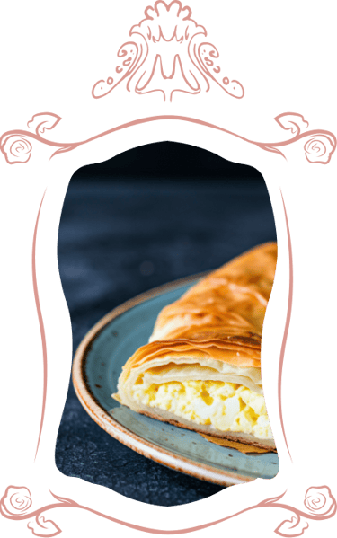 Banitsa on a plate surrounded with hand-drawn Baroque borders