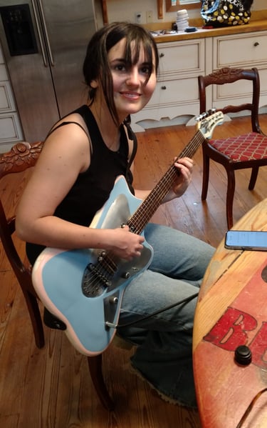 My daughter, famous painter, plays her Tumbleweed "Electric Barbarella"