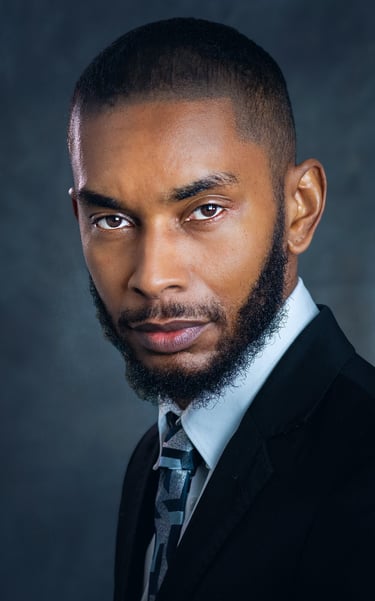 a man with a beard and a tie on a suit
