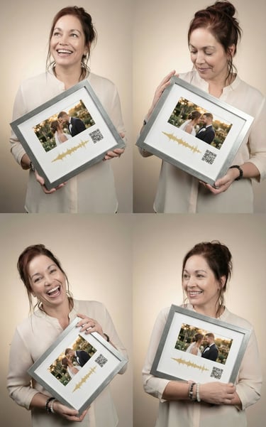 a woman holding a picture frame with a keepsakesQR.com QR code with a picture of a man and woman