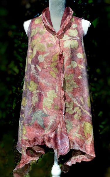 Handmade nuno felted vest with botanical leaf prints and ruffled edges displayed on a white mannequin.