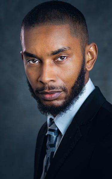 a man with a beard and a tie on a suit