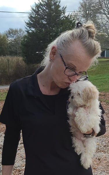 Lady kissing Female Mal-Shi Pup