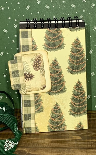 Christmas tree themed covered spiral covered notebook and hidden paper clipan