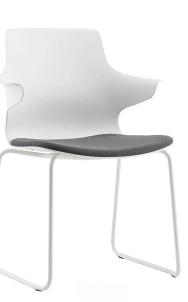 White Dora chair with grey seat cushion and sled base frame