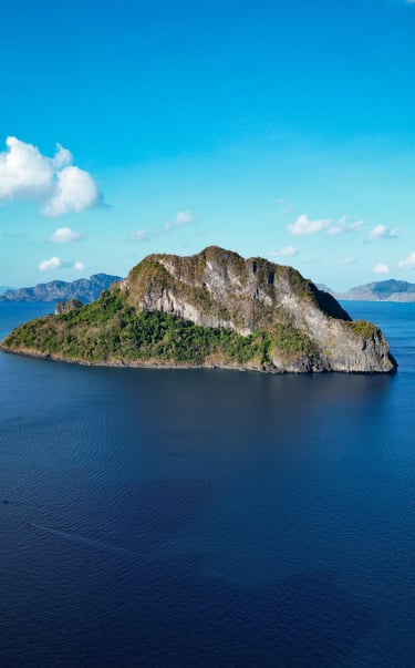 a small island with a small island in the middle of the ocean
