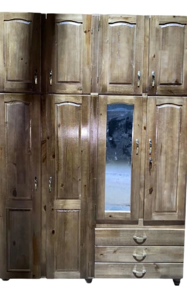 a wooden cabinet with a mirror and a mirror