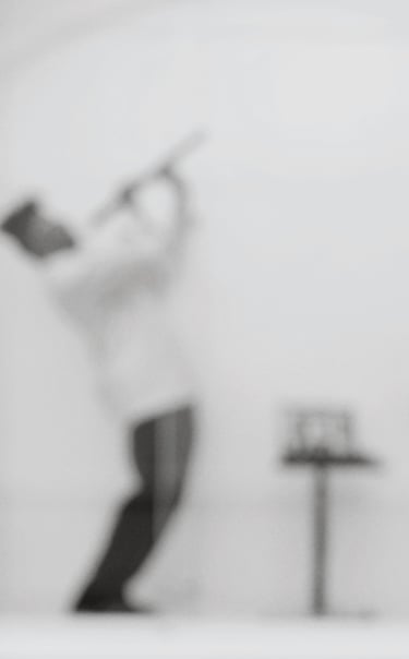 a man in a white shirt and black pants