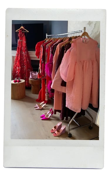 dhm.style styling concierge with luxury red and pink designer dresses and heels.