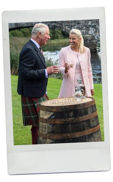 dhm.style styling concierge photo with King Charles and guests at a riverside event.