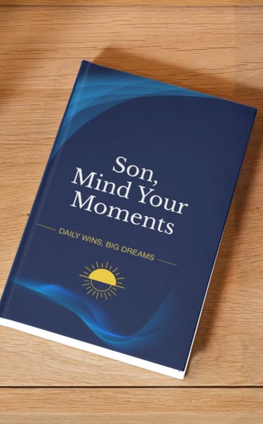 Son, Mind Your Moments journal with a blue cover and sun icon on a wooden table.