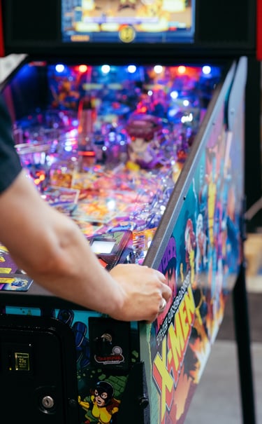 A pinball machine is being played