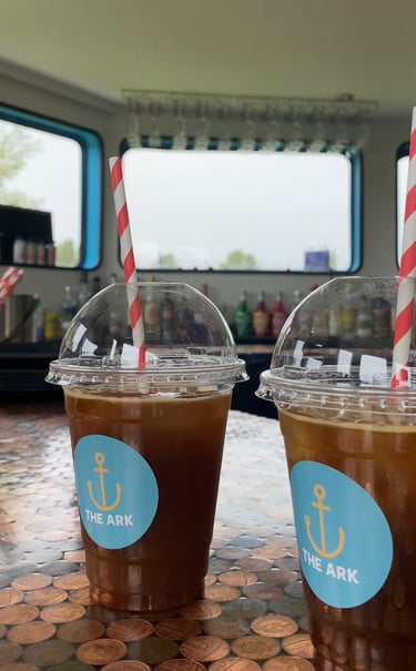 two iced americanos for takeaway from the ark northampton vegan cafe