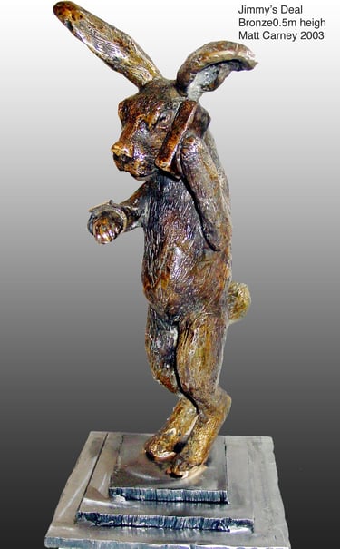 a bronze sculpture of a rabbit withon the phone looking at his watch