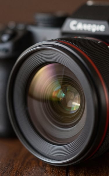 Close-up detail of a professional camera lens reflecting soft studio lights, with warm brown #4B2E2B and deep black #0D0D0D tones, symbolizing technical precision and artistic focus.