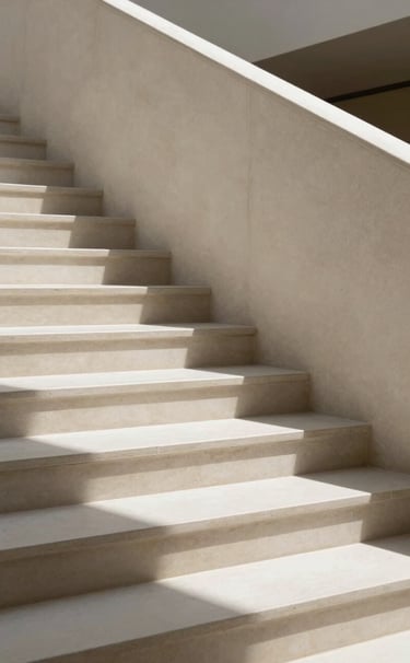 Close-up architectural detail of a modernist staircase in a high-end European art gallery. Stark shadows fall across off-white stone steps, creating sharp geometric patterns. Clean, editorial composition with no visual clutter.