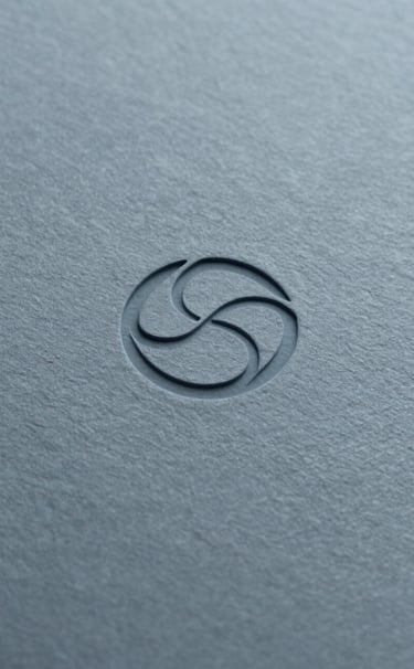 A extreme close-up of a high-quality paper texture in #8D9FB5 greyish blue. A logo is blind-debossed into the center, showing meticulous craftsmanship and sharp edges. Minimalist, architectural lighting.