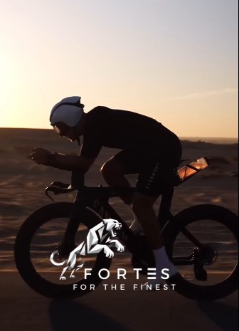a man riding a bike in the desert