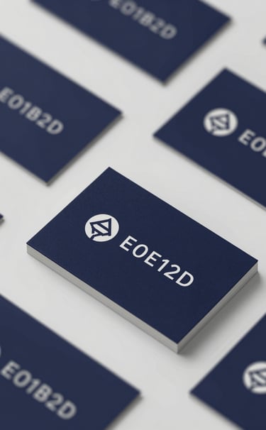 A sleek, professional business card design layout. The cards are dark navy (#0D1B2A) with silver-white (#E0E1DD) minimalist logos. Elegant composition on a neutral surface.