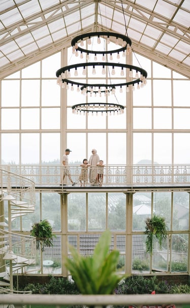 Family walking in rain during a family photography session at Rumah Gemuk Bedugul Bali.