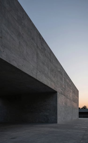 Wide angle shot of a modernist concrete structure at twilight. Deep shadows in #0A0A0C and highlights in #F5F7FA. Cinematic, calm, and professional photography.