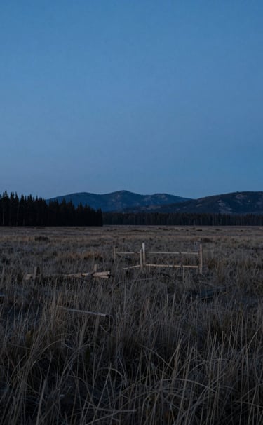 A cinematic wide shot of a North American landscape during the blue hour, captured as a still from a documentary film. The composition is clean and modern with a cool, thought-provoking mood.