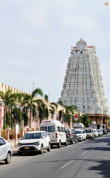 White Gopuram of Sri Ranganathaswamy Temple with massive outer walls resembling a fortress in Srirangam, Tamil Nadu.