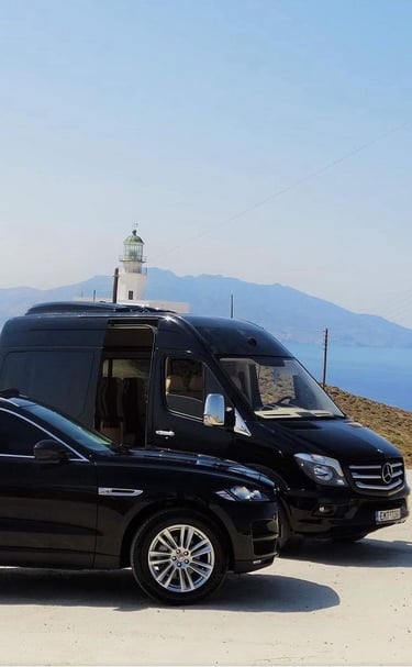 a van parked on a hill with a lighthouse in the background