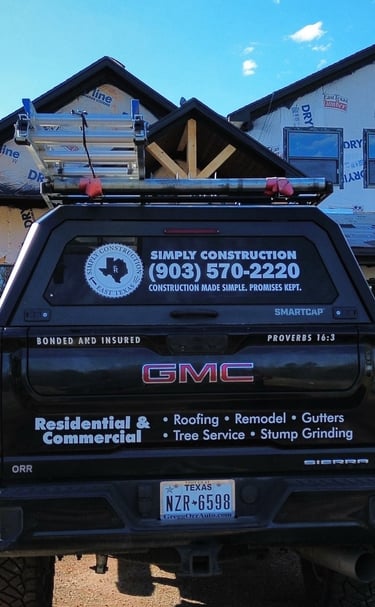Work truck at jobsite for a roof installation on brand new home construction in Tyler, TX