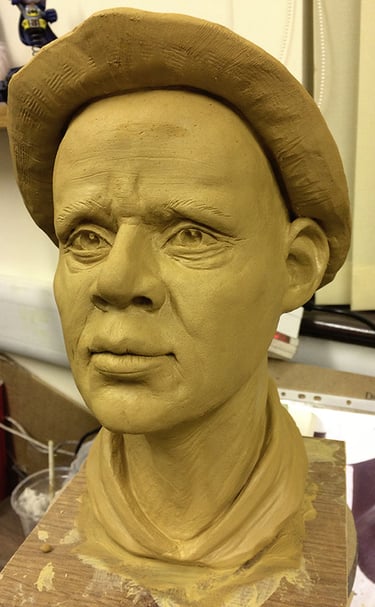Realistic male portrait bust sculpted in clay for bespoke 3D sculptural services