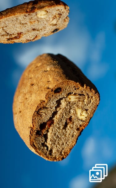 a piece of bread flying with a slice of bread the top of it