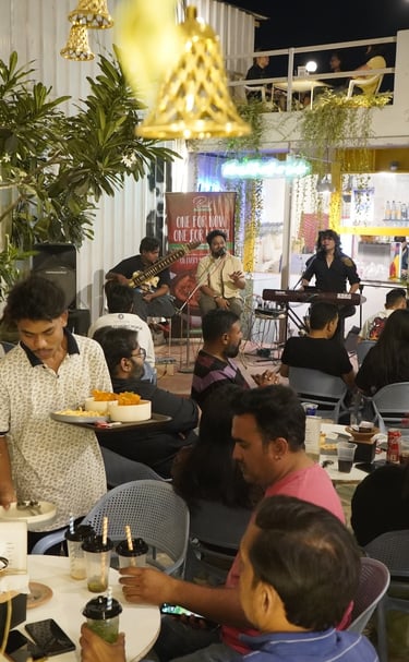a man serving food to a crowd of people in live music event