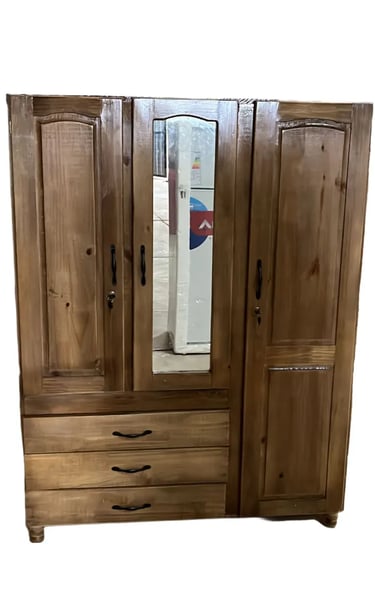 a wooden armoire with a mirror and a mirror