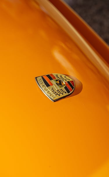 Porsche logo close-up photo captured by BrandNests for automotive marketing and branding.